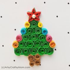 a christmas tree made out of rolled up paper