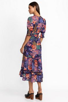 Embellished with bold floral blooms, the Daphne Tea Length Dress is crafted from a unique lightweight silk blend. Featuring a split neckline and gently puffed half sleeves, this dress offers an elastic waist and gathers throughout and is finished with pockets and a stunning tiered skirt. Pair with classic flats and a bold clutch for a night out. Women's Daphne Tea Length Dress by Johnny Was in Etta S Garden Blue, Size 2XL, Silk, Floral Flowy Floral Midi Dress For Garden Party, Silk Floral Print Maxi Dress For Brunch, Floral Print Midi Dress For Beach And Garden Party, Floral Midi Dress For Beach And Garden Party, Floral Print Maxi Dress For Beach Garden Party, Silk Floral Print Dress For Garden Party, Bohemian Floral Print Maxi Dress For Garden Party, Silk Floral Dress For Garden Party, Beach Maxi Dress With Floral Print For Garden Party