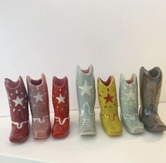 five toy boots lined up in a row