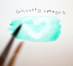 a heart drawn on top of a piece of paper with the words ghostly images written above it