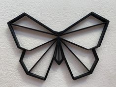 a black metal bow hanging on the wall