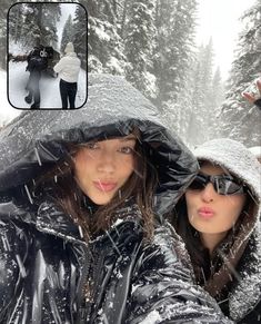 two women in the snow taking a selfie with an instagram frame above them