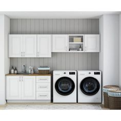 a washer and dryer in a white laundry room with gray paneling on the walls