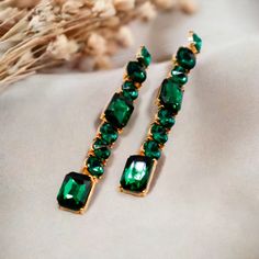 Crafted from an exquisite faux green diamond and cut into a sleek one-line straight shape, these earrings bring a touch of luxury to any look. Perfect for special occasions or special holiday events, these earrings will make sure you shine. Length: 3.5 inches Care: Avoid contact with water and cosmetics, such as creams or perfumes. Luxury Festive Emerald Earrings, Luxury Emerald Green Earrings, Coffee And Espresso Maker, Flat Wedges, Holiday Events, Lip Hair, Sustainable Fashion Brands, Green Diamond, Sweater Set