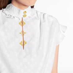 Tailored from soft cotton poplin embellished with monogram fil coupé, this frill blouse features rich details such as gold lv buttons at the collar and golden monogram flower shape embellishments along the front. With feminine frill details at the collar and sleeves, this iconic louis vuitton piece is a wardrobe must-have. Louis Vuitton Store, Louis Vuitton Official Website, Frill Blouse, Louis Vuitton Official, Fashion Books, Boutique Jewelry, Cotton Poplin, No Frills, Latest Design