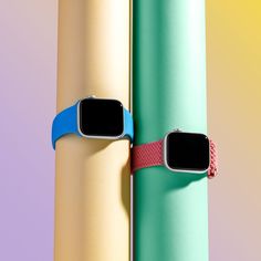 an apple watch is attached to two different colored tubes