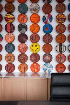 there are many basketballs on the wall in this room