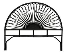 an iron bed frame with a sun design on it's headboard and foot board