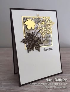 a card with some leaves on it