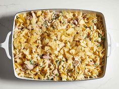 a casserole dish filled with pasta and meat