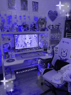 a room filled with furniture and pictures on the walls, including a computer desk covered in blue lights