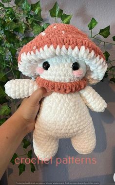 a crocheted stuffed animal wearing a hat