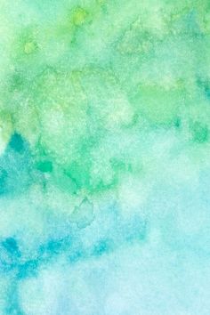 an abstract watercolor painting with blue and green colors