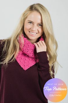 a woman wearing a pink crochet cowl