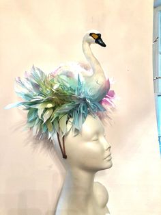 "Bird Fascinator- Horse Racing - Feather Headband- Swan Lake- Derby- Swan Headpiece- Halloween costume. Hello, It's perfect to add whimsical fun to any occasion. You'll be the life of the party with this great conversation piece This Fascinator has been featured in the New York Times, on Martha Stewart's blog and has won several hat contests! He also was also featured on Kathy Lee Gifford while she covered at Megan Markel's wedding in London! This has swan that is 10\" high with a matching puff Whimsical Headband For Carnival, Whimsical Headpieces With Matching Headband For Costume Party, Fitted Carnival Headband Headpiece, Fitted Headband For Carnival, Whimsical Headband Costume Hats For Party, Fitted Costume Headband Headpiece, Fitted Costume Headband, Whimsical Headband Fascinator For Costume Party, Whimsical Headband For Costume Party