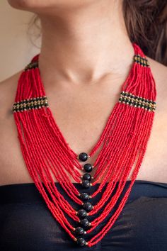 "Beautifull red layered necklace that is a true eye catcher. These nepalese traditional craftmanship necklaces (Mala) are made with a modern touch. A \"pote\" is a traditional nepali necklace made by stringing small cut (glass) beads. This necklace is designed in a trending long style and is durable and skin friendly." Red Fair Trade Beaded Necklace As Gift, Traditional Fair Trade Jewelry For Festivals, Artisan Red Beaded Necklaces For Festivals, Handmade Red Beaded Necklaces For Festivals, Artisan Red Beaded Necklace For Festivals, Red Fair Trade Jewelry With Round Beads, Red Necklaces For Rituals And Festivals, Fair Trade Jewelry For Festivals, Festive Fair Trade Jewelry For Festivals