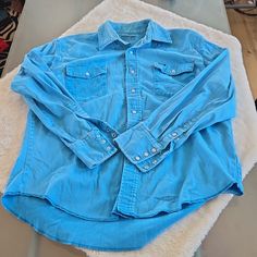 Description: Wrangler Long Sleeve Snap Down Shirt With Use Wear And Very Broke In. Please See Pictures For More Details. In Fair To Good Condition! Size (From Tag) L Measurement (Approximate) Neck: 8.25" Arm Pit To Arm Pit: 24." Shoulder To Shoulder: 19.75" Hip To Hip: 23" Back Of Collar To Tail: 29.5" Please Contact Me If Any Other Measurement’s Are Needed! Brand New Items Added Daily So, Make Sure And Visit My Closet Fast Shipper! Open To Offers! I Will Either Accept A Reasonable Offer Or Coun Classic Blue Tops For Rodeo, Blue Shirt For Summer Rodeo, Blue Shirt For Rodeo In Summer, Blue Summer Shirt For Rodeo, Blue Shirt With Pockets For Rodeo, Casual Cotton Shirt For Rodeo, Distressed Long Sleeve Tops For Rodeo, Medium Wash Cotton Western Shirt, Long Sleeve Washed Tops For Rodeo