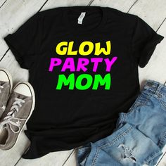 Glow Party Mom Shirt | glow party mom, glow party, glow in the dark, glow party shirt, birthday shirt, birthday party, neon party We print on everything! In our shop you will find our designs mostly on short sleeve shirts, but since we use Printful's printing services we can print any design on any type of shirt or item you can see here: https://www.printful.com/custom-products You are welcome to send us a message if you want a design printed on any of the items on the Printful website. Glow Par Birthday Party Neon, It's My Birthday Shirt, Neon Birthday Party, Tee Party, Party Neon, 80s Tees, Princess Shirt, Glow Party, Neon Party