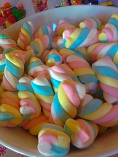 a bowl filled with lots of colorful candy