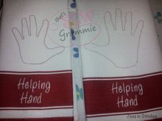 two hand towels with the words helping hand and helping hand written on them