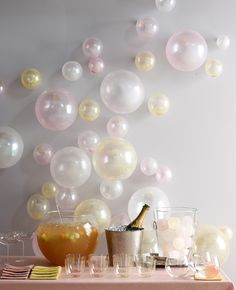 a table topped with lots of bubbles and drinks