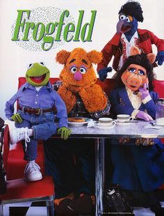 the muppets are sitting at a table together