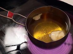 a pan filled with liquid sitting on top of a stove