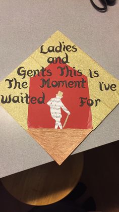 a graduation cap that reads ladies and gents this is the moment i've waited for