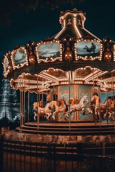 a merry go round at night with the lights on