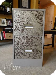 the drawers are decorated with flowers and scrolls on it's sides, along with bookshelves