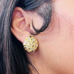 These small 10K gold round nugget earrings feature a unique textured design, accented with a sparkling cubic zirconia. Perfect for everyday wear, they add a subtle touch of elegance to any outfit. Dimensions: 20mm in diameter Gold Cluster Earrings With Sparkling Stones, Gold Cluster Earrings With Diamond Cut Cubic Zirconia, Gold Cubic Zirconia Round Clip-on Earrings, Gold Cubic Zirconia Cluster Earrings With Diamond Cut, Nugget Earrings, Picture Pendant, Initial Earrings, Initial Ring, Textured Design