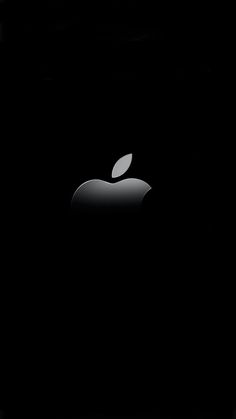 an apple logo is shown in the dark