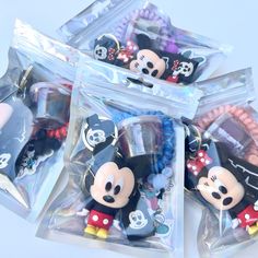 there are many mickey mouses in the bag