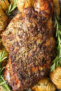 grilled pork chops with rosemary and potato wedges on the side, ready to be served