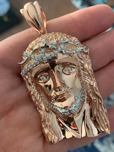 Stunning handmade Jesus pieces! Iced out for an out of this world shine!! Handmade in Italy! Will never turn green! SOLID 925 SILVER with 14k rose gold plated jesus VERY DETAILED...looks just like a $1000 solid gold piece CHAIN SOLD SEPARATELY Chain in photos is for illustration only Small fits chains up to 3mm thick Medium-Huge fits chains up to 7mm thick Looks nice on a rope or a Miami Cuban Link We also have the same piece in rose gold finish and also natural silver Iced Out Cross Chain, Gold Iced-out Cuban Link Necklace, Yellow Gold Iced Out Pendant Necklace, Luxury Iced-out Cuban Link Necklace For Gifts, Gold Iced Out Cross Pendant Jewelry, Italy Necklace, Jesus Piece, 10k Gold Chain, Red Stone Ring