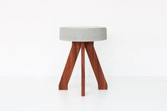 the stool is made out of wood and concrete