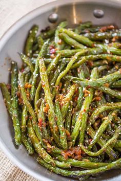 cooked green beans in a pan with seasoning