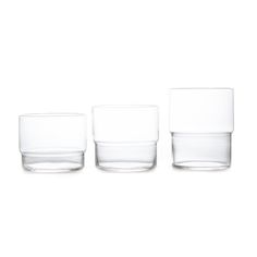 three clear glasses sitting next to each other