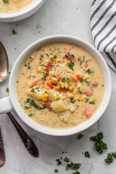 two bowls filled with soup on top of a table