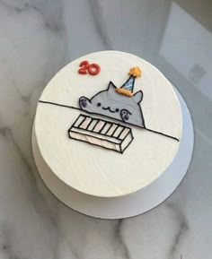 a birthday cake with an image of a cat on it