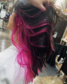 Pink peekaboo highlights with dark brown hair Pink Highlights Peekaboo, Peek A Boo Color Curly Hair, Dark Brown With Pink Underneath, Cute Hair Colors For Dark Brown Hair, Dyed Hair Tips Brown, Brown And Pink Hair Underneath, Dark Hair With Pink Peekaboo