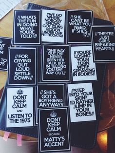 several black and white stickers with words on them