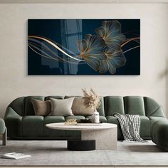 a living room scene with focus on the couch and large flower art hanging above it