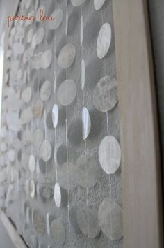 the wall is decorated with white and silver circles