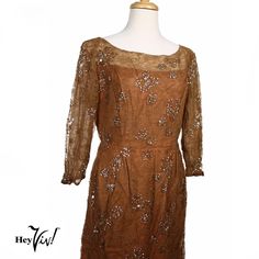 Vintage Martini Designed Sheath Dress Brown Lace w Sequins B36 W29 - Hey Viv !  * Special Feature: Vintage Martini Designed Sheath Dress is cocoa brown lace embellished with sequins.  * Material: lace and sequins  * The dress is fully lined with a copper colored satin. The top of the bodice is lined with sheer mesh fabric. The sleeves are lined with a sheer brown fabric.  * Closure: back metal zipper and top hook  * Tag: Martini Designed  * Measurements: Bust: 36", Waist: 29", Hips: 40", Length Waist to Hem: 31", Sleeves: 18" The body of the dress is in good condition considering the age and that it is made of lined lace. The lace under both arms and around the shoulder seams has some splits and open areas. The lining fabric underneath is still intact so you don't see the splits until clos Fitted Brown Dress For Festive Occasions, Festive Formal Brown Dress, Vintage Fitted Dress For Mother Of The Bride, Vintage Martini, The Splits, Cocoa Brown, Brown Fabric, Staten Island, Metal Zipper