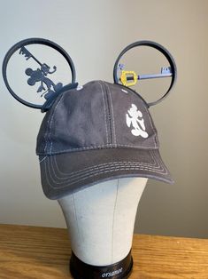 a mickey mouse hat on top of a head