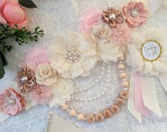 a close up of flowers and pearls on a table