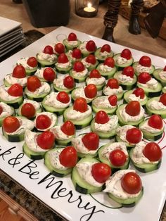 cucumber cups with cherry tomatoes and whipped cream on them are ready to be eaten