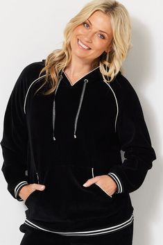 Indulge in the cosy luxury of the Maxwell Rib Velour Hoodie in black. This essential brings a sporty elegance to lounge wear with its soft ribbed velour fabric and striking lurex accents. Whether you're unwinding at home or stepping out for a casual day, the Maxwell hoodie will wrap you in comfort without compromising on style. Soft ribbed velour material for supreme comfort Lurex piping and stripe details for a classic sporty look Kangaroo pocket for convenience Hood with lurex stripe drawstring Elastic cuffs and hem to keep the warmth in Model Chella is wearing a size S. She is 175cm tall with an 89cm bust, 74cm waist and 96cm hips. Velour Hoodie, Hoodie Xxl, Velour Fabric, Cardigan Vest, Stepping Out, Fashion Over 50, Sporty Look, Pant Shirt, Back To Black