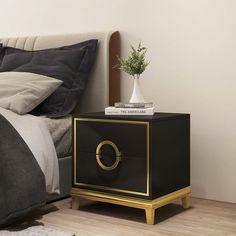 a black and gold nightstand next to a bed